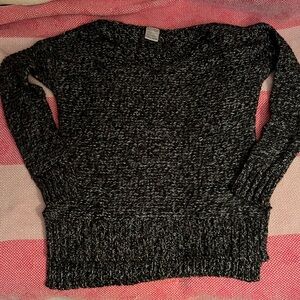 Razzle Dazzle Women’s size XS black knit sweater.  Asymmetrical bottom.